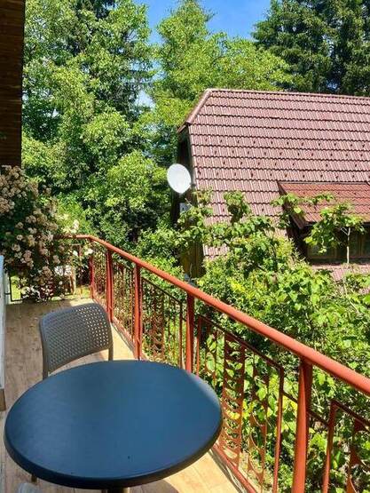 Balcony with a view of the countryside at House by the River